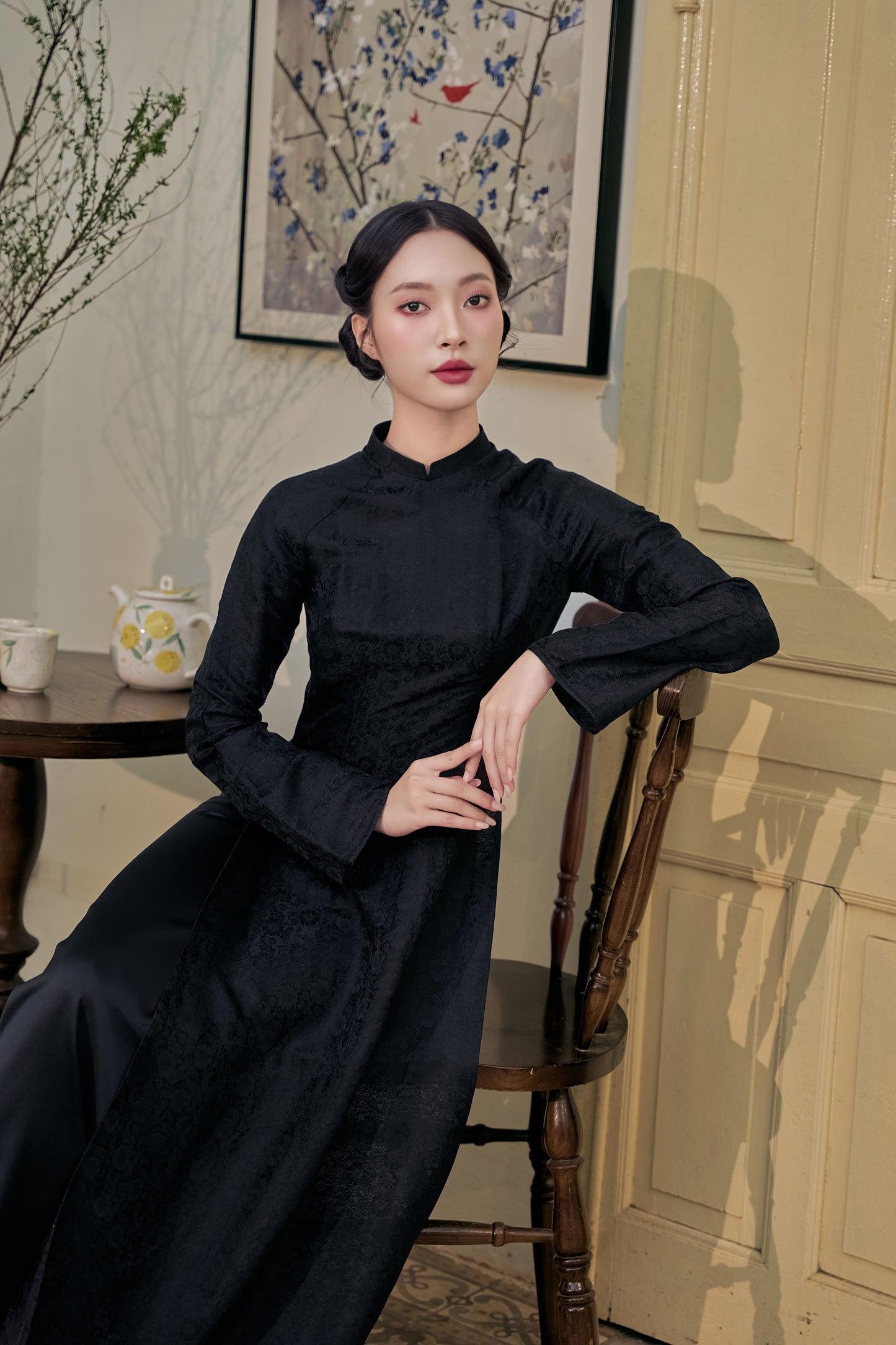 Black silk Ao Dai, sitting posture